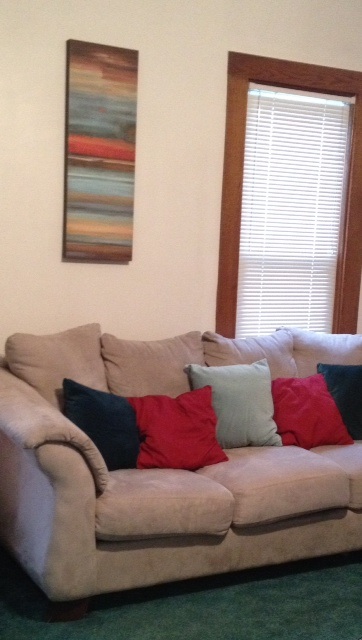Yay for a clean couch, new pillows, art, and no ugly floral curtains! :)